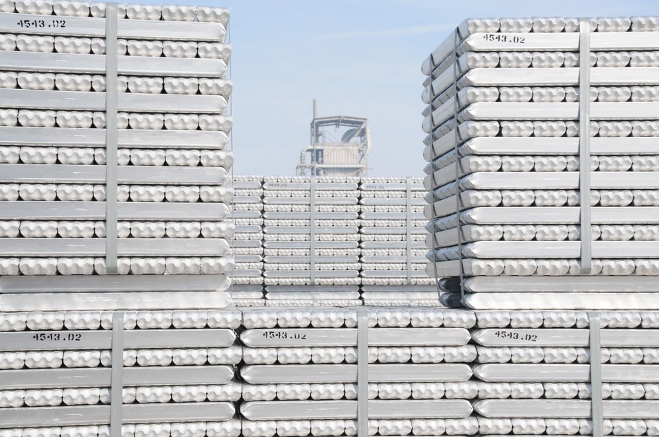 Stacks of bundled aluminum Properzi ingots in an industrial yard